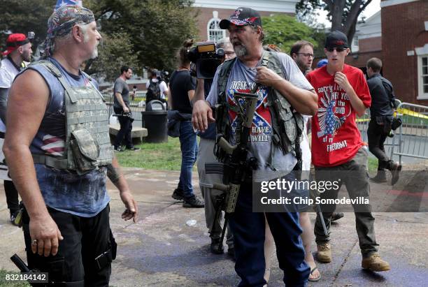 White nationalists, neo-Nazis, the KKK and members of the "alt-right" attempt to organize inside Emancipation Park during the Unite the Right rally...