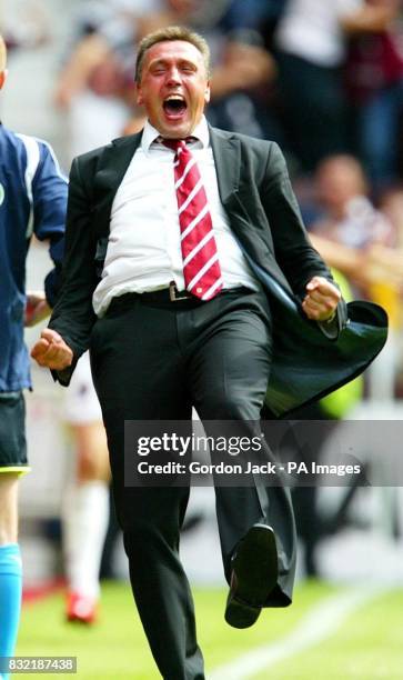 Hearts manager Valdas Ivanauskis celebrating the winning goal against Celtic during the Bank of Scotland Premier League match at Tynecastle Stadium,...