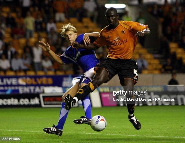 Wolverhampton Wanderers' Seyi Olofinjana is challenged by Dan Harding of Ipswich Town during the Coca-Cola Championship match at the Molineux,...