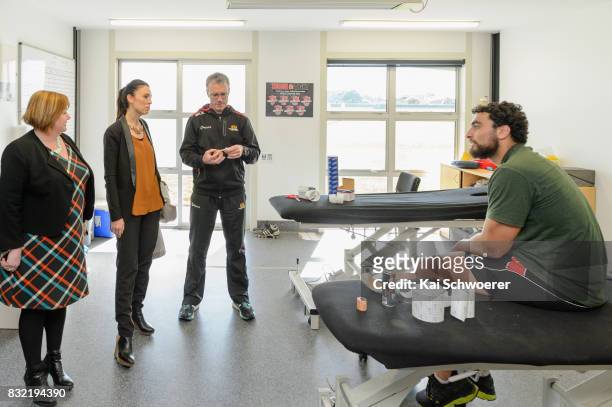 Labour MP Megan Woods, Labour Leader Jacinda Ardern, Canterbury Physiotherapist John Roche and Alex Hodgman of Canterbury look on during a visit at...