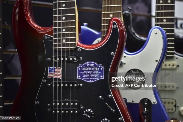 Different guitar models made by US manufacturer Fender in Corona, California, are displayed at the Custom Shop of Holocausto Audio Iluminacion...