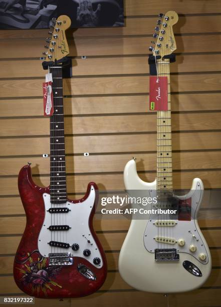 Models of American Professional Series guitars made by US manufacturer Fender are displayed at the Custom Shop of Holocausto Audio Iluminacion...