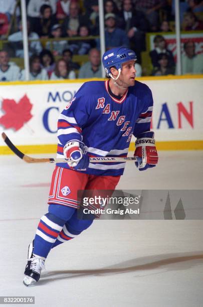 Doug Lidster of the the New York Rangers turns up ice against the Toronto Maple Leafs during NHL game action on October 14, 1995 at Maple Leaf...
