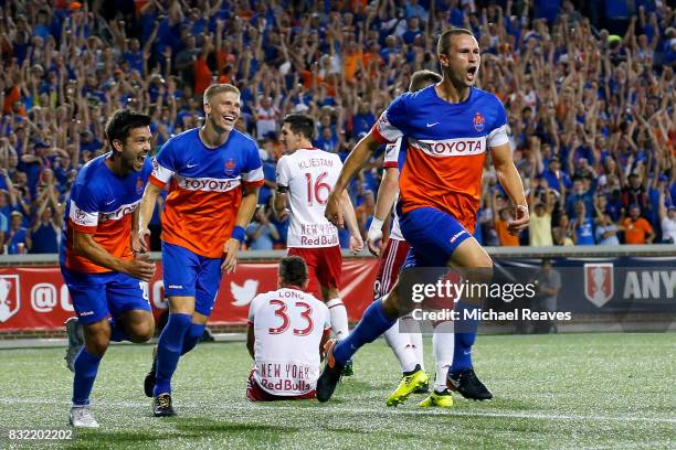 Cincinnati defender Austin Berry celebates after scoring a goal in the second half against the New York Red Bulls during the semifinal match of the...