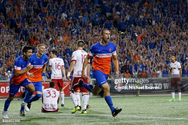 Cincinnati defender Austin Berry celebates after scoring a goal in the second half against the New York Red Bulls during the semifinal match of the...