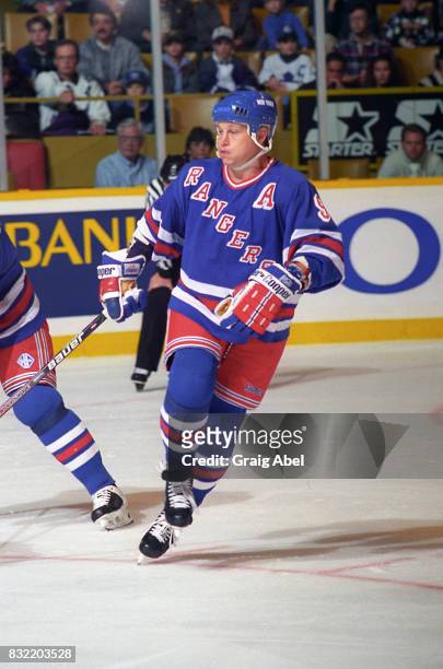 Adam Graves of the the New York Rangers turns up ice against the Toronto Maple Leafs during NHL game action on October 14, 1995 at Maple Leaf Gardens...