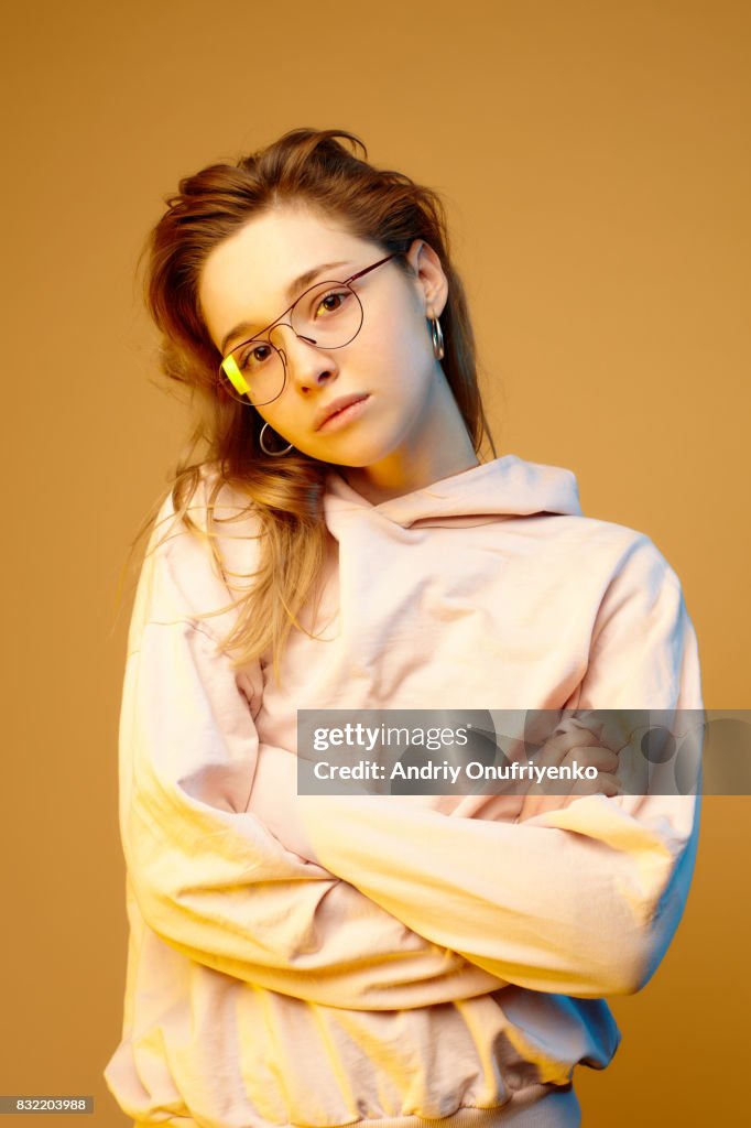 Studio shot of young woman wearing glasses