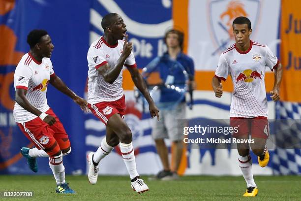 New York Red Bull forward Bradley Wright-Phillips celebrates with teammates after scoring a goal against FC Cincinnati in the second half of the...