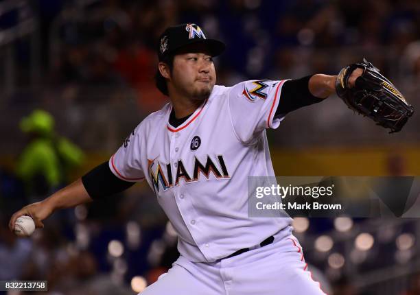 Junichi Tazawa of the Miami Marlins pitches in the seventh inning during the game between the Miami Marlins and the San Francisco Giants at Marlins...