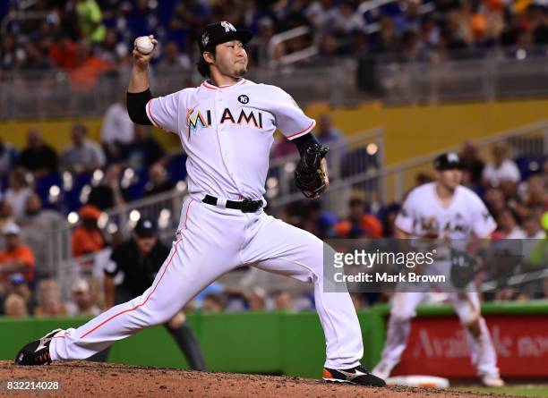 Junichi Tazawa of the Miami Marlins pitches in the seventh inning during the game between the Miami Marlins and the San Francisco Giants at Marlins...