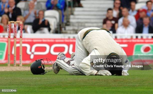Mohammad Yousaf kisses the ground in celebration at reaching his century during the second day of the fourth NPower test between England and...