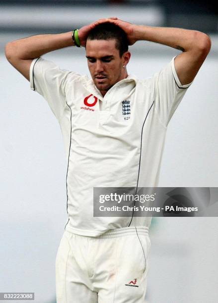 Kevin Pietersen rues a drop by Marcus Trescothick, in a failed bid to dismiss Mohammad Hafeez, during the second day of the fourth NPower test...