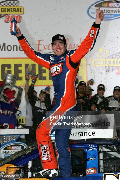 Kyle Busch, driver of the NOS Energy Drink Toyota, celebrates in victory lane after winning the NASCAR Nationwide Series Dollar General 300 at Lowe's...