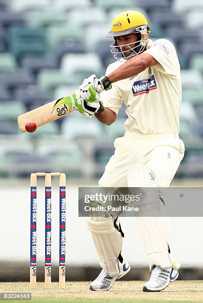 Theo Doropoulos of the Warriors plays a cut shot during day two of the Sheffield Shield match between the Western Australian Warriors and the New...