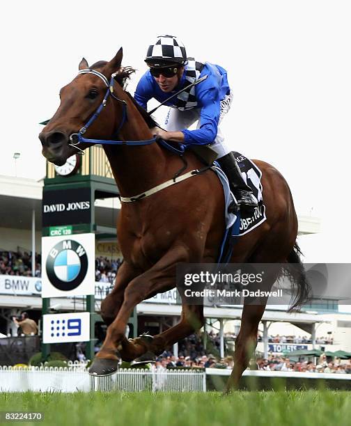 Jockey Michael Rodd riding Whobegotyou eases up on the line as they win The Age Caulfield Guineas during the Caulfield Guineas Day meeting at...