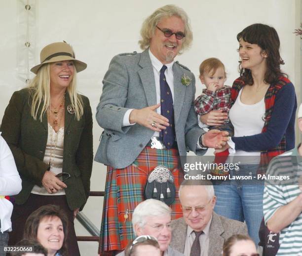 Comedian Billy Connolly attends the Lonach Highland Games in Aberdeenshire with wife Pamela Stephenson and daughter Cara and grandchild .