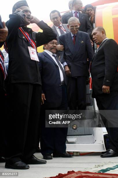 Free Aceh Movement founder Hasan di Tiro disembarks from a plane shortly after arriving in Banda Aceh on October 11, 2008. The founder of Aceh's...