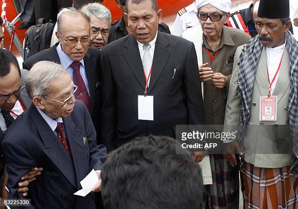 Free Aceh Movement founder Hasan di Tiro greets people shortly after arriving in Banda Aceh on October 11, 2008. The founder of Aceh's separatist...