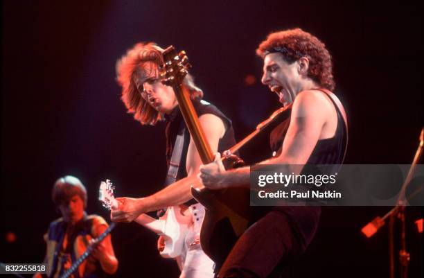 Guitarists Jonathan Cain, left, and Neal Schon of Journey perform at the Rosemont Horizon in Rosemont, Illinois, June 11, 1983.