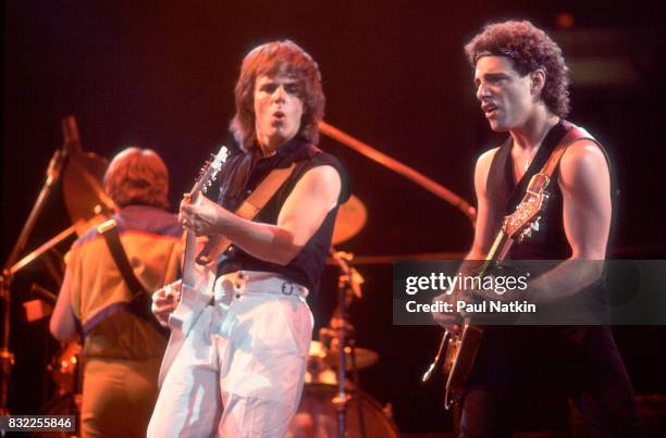 Guitarists Jonathan Cain, left, and Neal Schon of Journey perform at the Rosemont Horizon in Rosemont, Illinois, June 11, 1983.