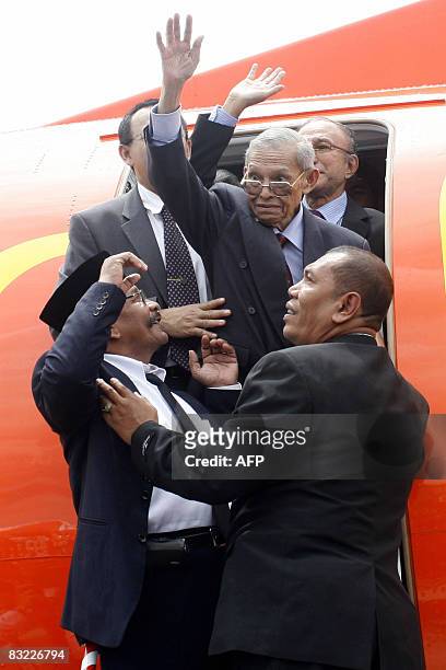Free Aceh Movement founder Hasan di Tiro waves from a plane shortly after arriving in Banda Aceh on October 11, 2008. The founder of Aceh's...