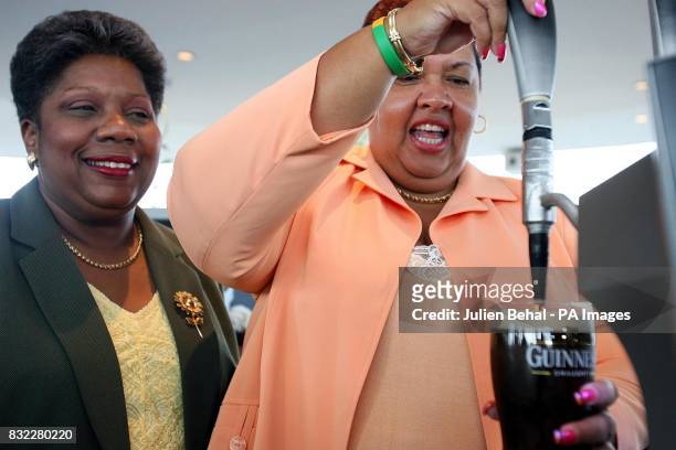 Jamaica's Minister for Tourism, Aloun Ndombet Assamba enjoys pulling her first pint of Guinness in the Guinness Gravity bar, Dublin, with Director...