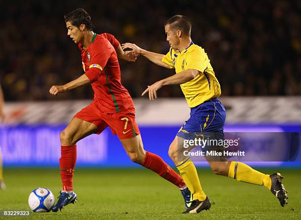 Cristiano Ronaldo of Portugal is shadowed by Daniel Andersson of Sweden during the FIFA 2010 World Cup European Group 1 Qualifier between Sweden and...