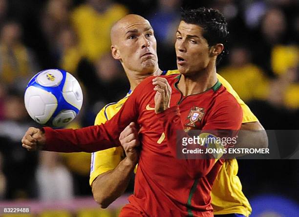 Sweden's Daniel Majstorovic vies for the ball with Portugal's Cristiano Ronaldo during their World Cup 2010 qualifying match on October 11, 2008 at...