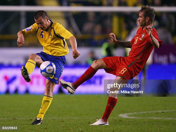 Daniel Andersson of Sweden is put under pressure by Raul Meireles of Portugal during the FIFA 2010 World Cup European Group 1 Qualifier between...