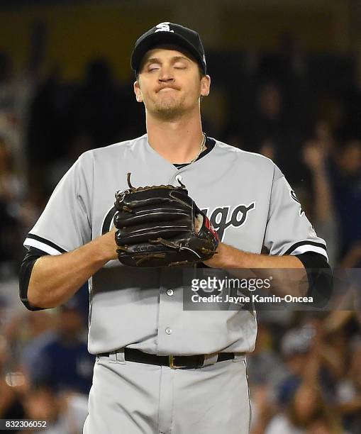 Jake Petricka of the Chicago White Sox grimaces after hitting Joc Pederson of the Los Angeles Dodgers with a pitch which allowed the winning run to...