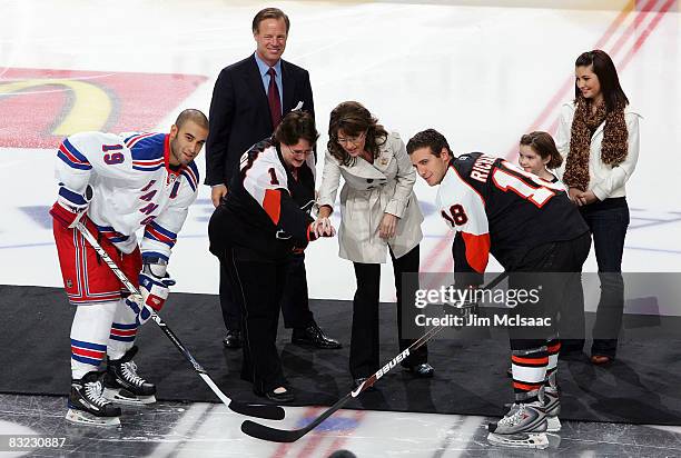 Republican vice-presidential candidate Alaska Gov. Sarah Palin and Flyers 'Hockey Mom' contest winner Cathy O'Connell drop the ceremonial first puck...