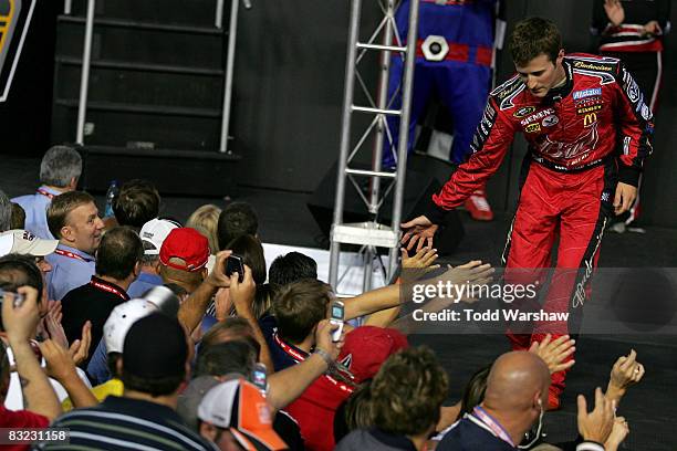 Kasey Kahne, driver of the Budweiser Dodge, greets fans before the NASCAR Sprint Cup Series Bank of America 500 at Lowe's Motor Speedway on October...