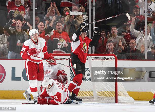 Nick Foligno of the Ottawa Senators celebrates his second period goal against Niklas Kronwall and Valtteri Filppula of the Detroit Red Wings at...