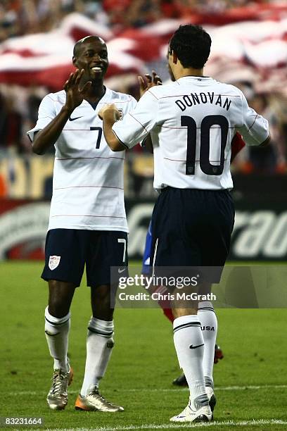 Landon Donovan of the USA celebrates scoring a goal with teammate DaMarcus Beasley during the FIFA World Cup 2010 qualifying match between Cuba and...