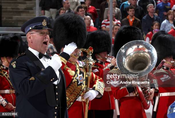 Ontario Provincial Police constable Lyndon Slewidge sings the national anthems with the Governor General's Footguards band prior to the Ottawa...