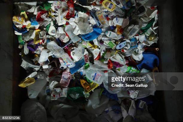 Discarded plastic drinks cartons lie in a bin at the ALBA sorting center for the recycling of packaging materials on August 15, 2017 in Berlin,...