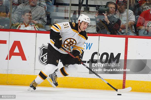 Marc Savard of the Boston Bruins skates with the puck against the Minnesota Wild during the game at the Xcel Energy Center on October 11, 2008 in...