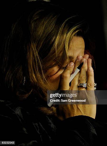 Kim Burton, wife of Jeff Burton, driver of the AT&T Mobility Chevorlet, shows emotion during the last laps of the NASCAR Sprint Cup Series Bank of...