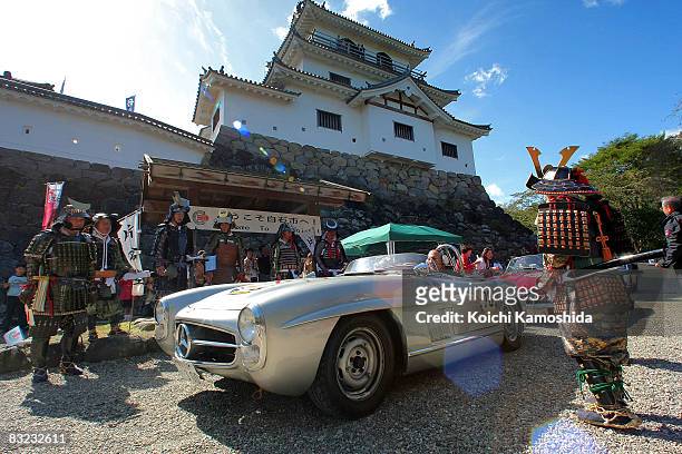 Susie Moss and Stirling Moss drive during the 2008 La Festa Mille Miglia classic car rally at the Shiroishi Castle on October 12, 2008 in Miyagi,...
