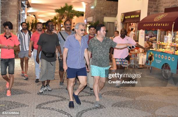 Saudi Prince Al-Waleed Bin Talal bin Abdulaziz al Saud arrives at a restaurant at Marina district with Advisor to the Turkish Prime Ministry, Taha...