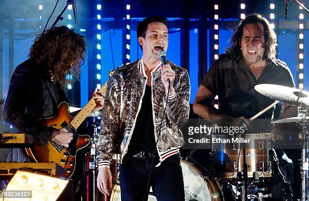 The Killers guitarist Dave Keuning, singer Brandon Flowers and drummer Ronnie Vannucci perform at the 13th annual Andre Agassi Charitable...