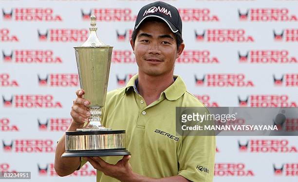 Liang Wen-chong if China poses with the trophy after winning the Hero Honda Indian Open at the Delhi Golf Club in New Delhi on October 12, 2008. AFP...