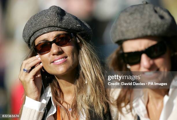 Wives of USA team members Melissa Lehman and Amy DiMarco look on.