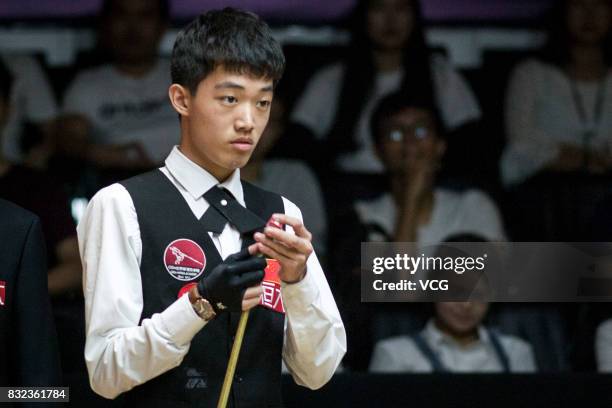 Luo Honghao of China reacts during a qualifying match against Mark Selby of England on day one of Evergrande 2017 World Snooker China Champion at...