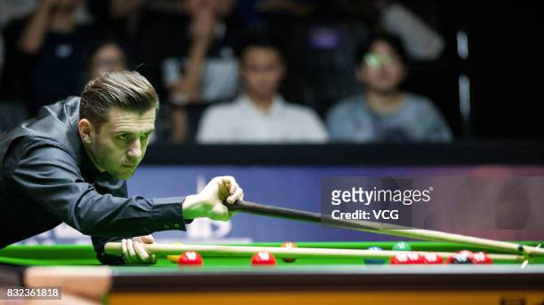 Mark Selby of England plays a shot during a qualifying match against Luo Honghao of China on day one of Evergrande 2017 World Snooker China Champion...