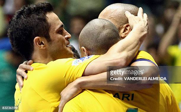 Brazil's futsal players celebrate their 3-0 victory over Italy, during a match of the FIFA Futsal World Cup, on October 12, 2008 at Maracanazinho...
