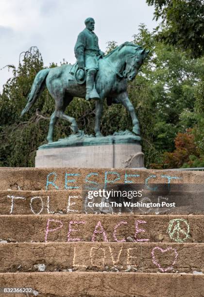 Messages of peace and tolerance are drawn in chalk on the steps leading to the entrance of Emancipation Park, recently renamed from Lee Park, in...