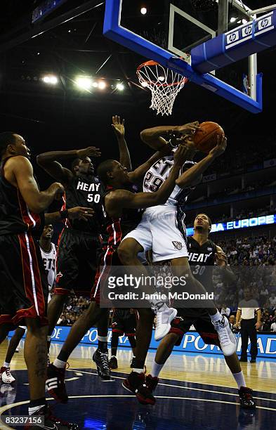 Brian Hamilton of New Jersey Nets battles for the rebound with Dwyane Wade of the Miami Heat during the NBA preseason game as part of the 2008 NBA...
