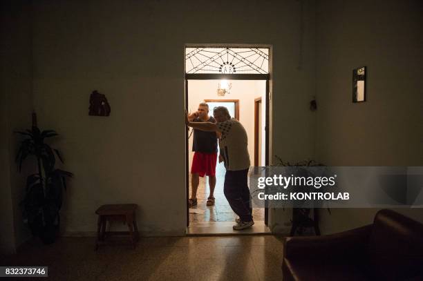 Some people call for help on the phone for a vast fire near their home, in Sila, Calabria, southern Italy.