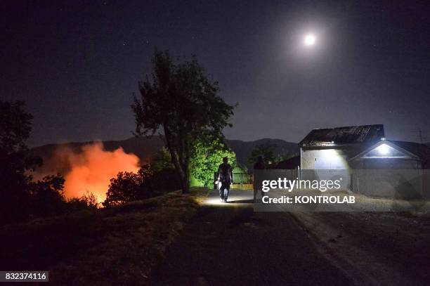 Vast fire in the Sila mountains, in Calabria, southern Italy, near a home.